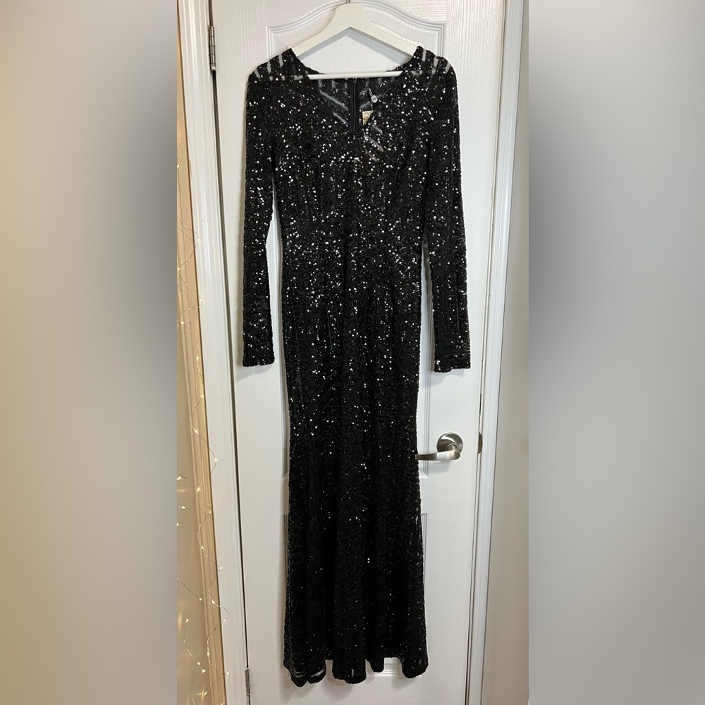 Black dress. Size 4 US - 6 US. Brand new with tags.